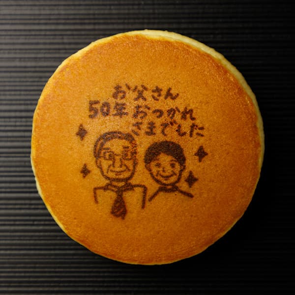 お父さん 50年 おつかれさまでした（二人の似顔絵）